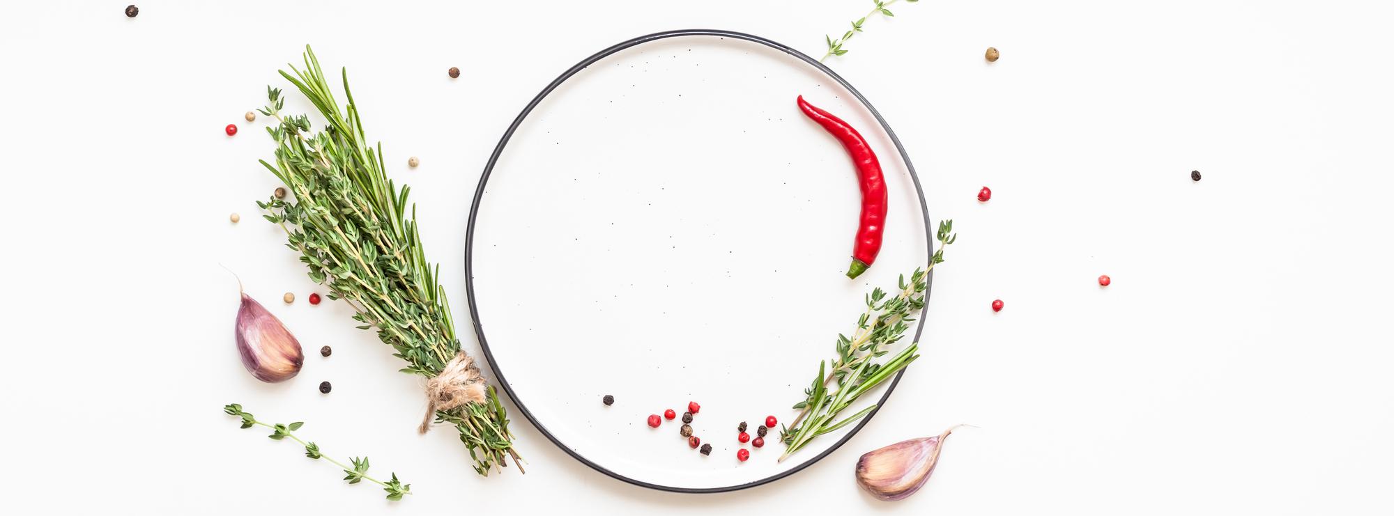 Large composed plate with herbs and sauce