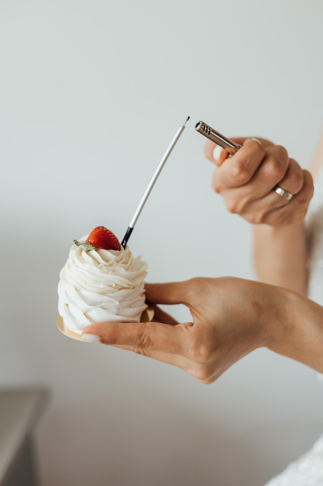 Hands plating a dessert